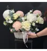композиция из белых и розовых одноголовых хризантем, кремовых роз и белой эустомы с эвкалиптом в корзине